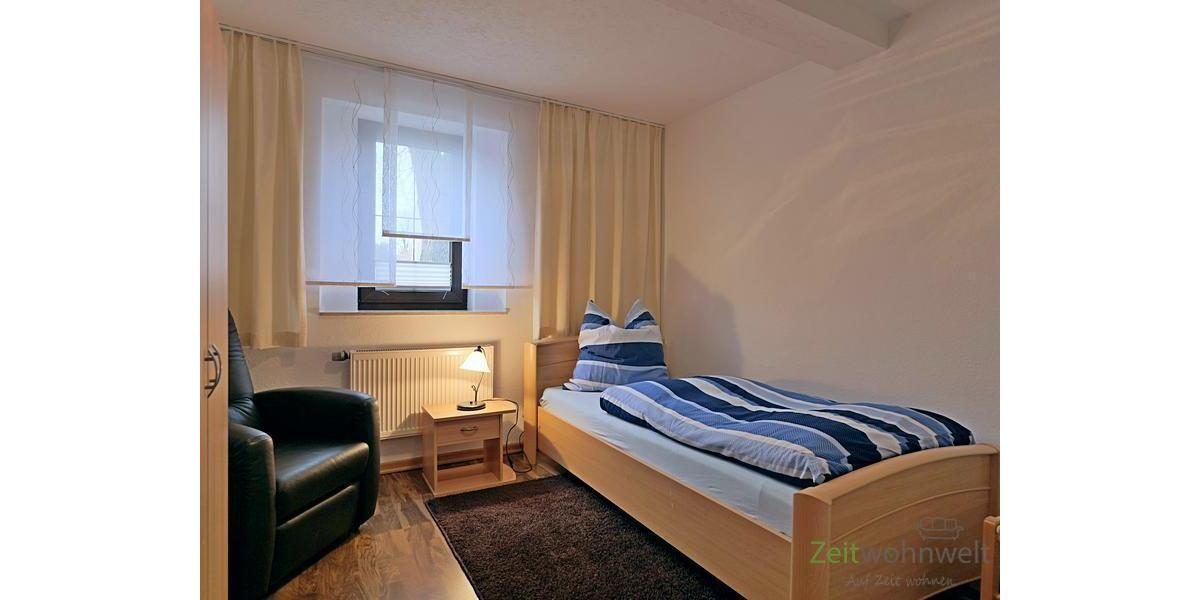 Schlafzimmer mit Sessel